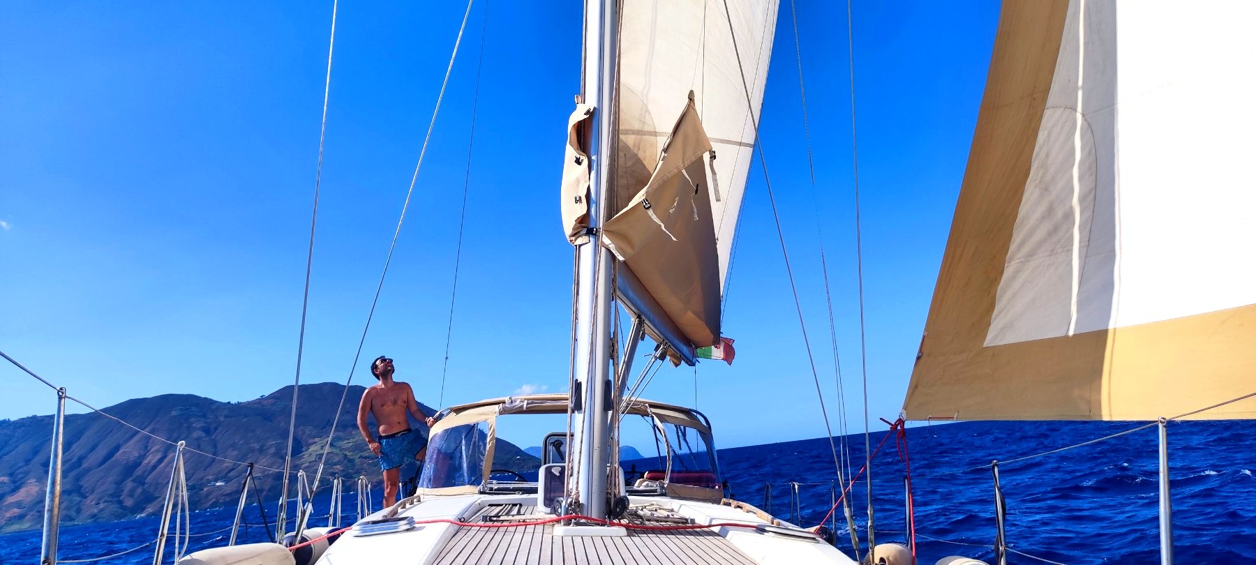 Sails up, under way